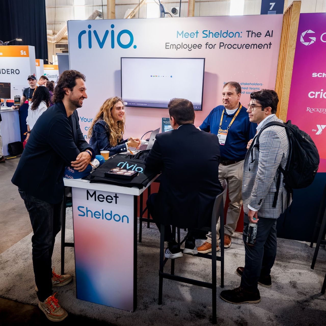 Rivio team meeting procurement leaders at the DPW New York booth